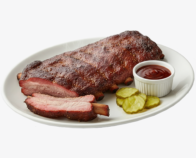 Half rack of Memphis ribs with sauce and pickles